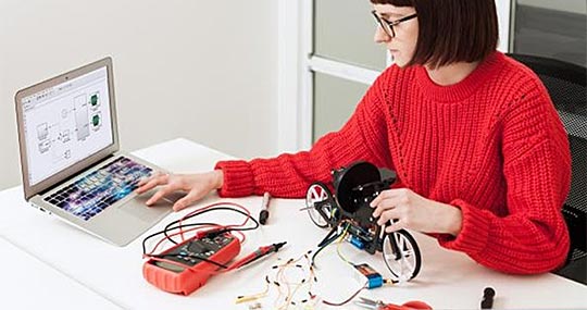Student programming with ThingSpeak, MATLAB, and hardware.